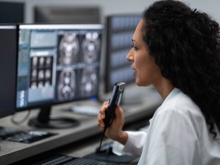 Healthcare Female Worker In-Hospital With Computer And-MRI